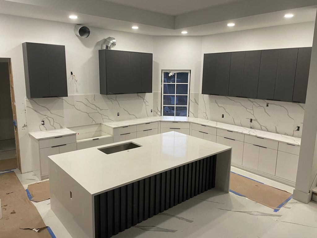 Modern kitchen renovation with island and integrated storage